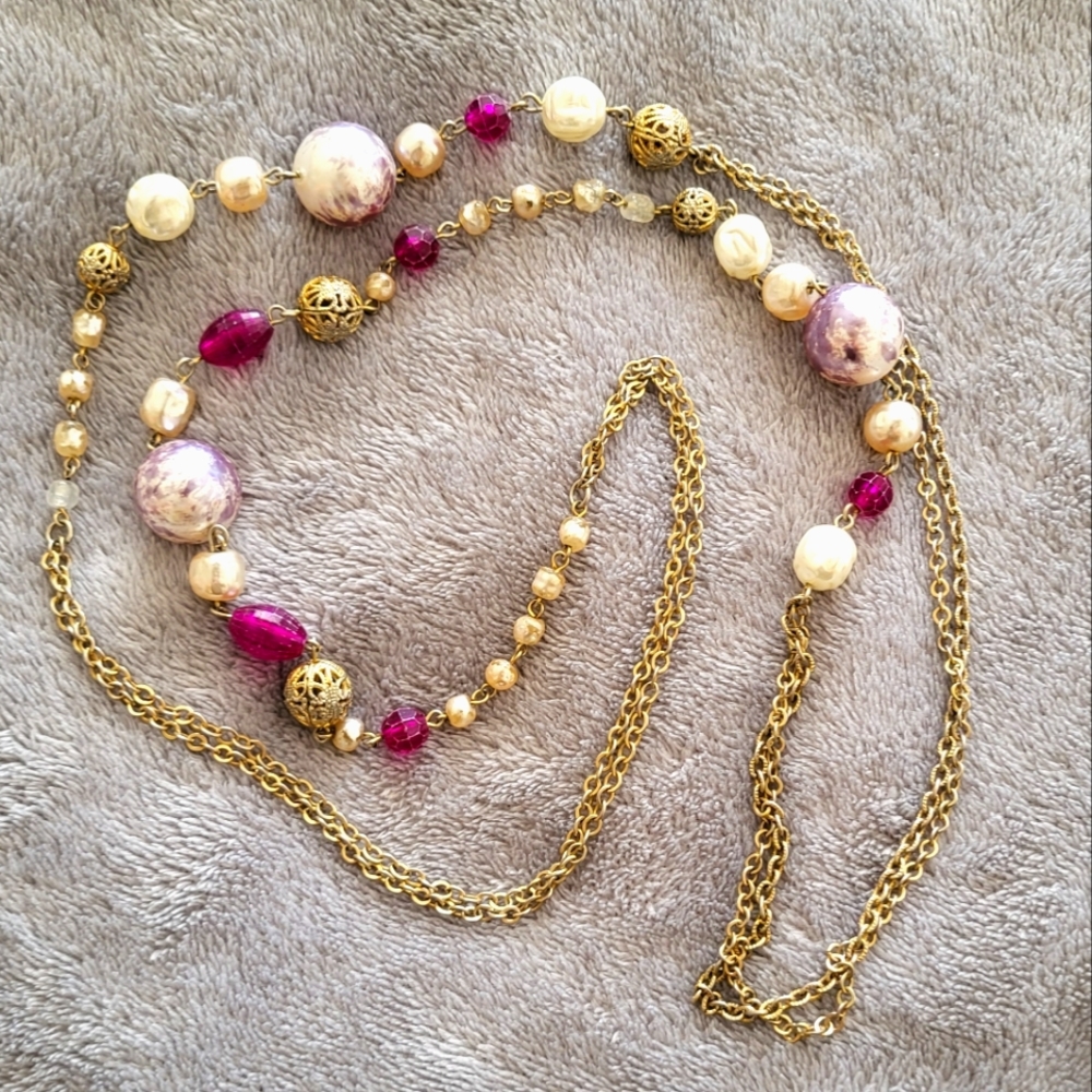 Long purple bead and silver tone necklace